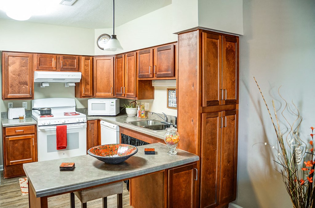 a kitchen with wooden cabinets and a counter top