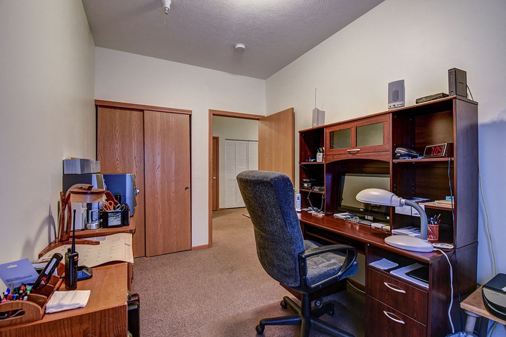 a home office with a desk and a computer