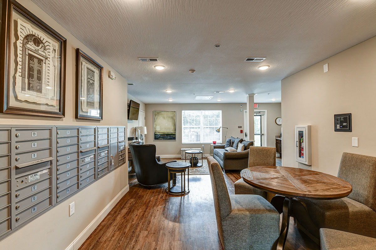 a living room with couches and chairs and a table