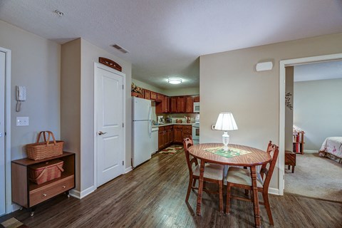 a kitchen and dining room with a table and chairs