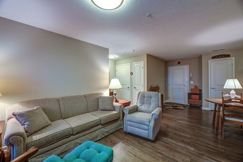 a living room with a couch and a chair