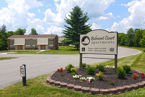 the sign in front of the schuman court apartments building