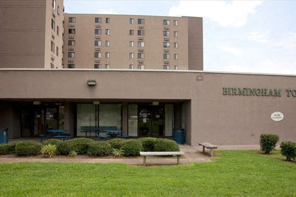 a large building with a bench in front of it