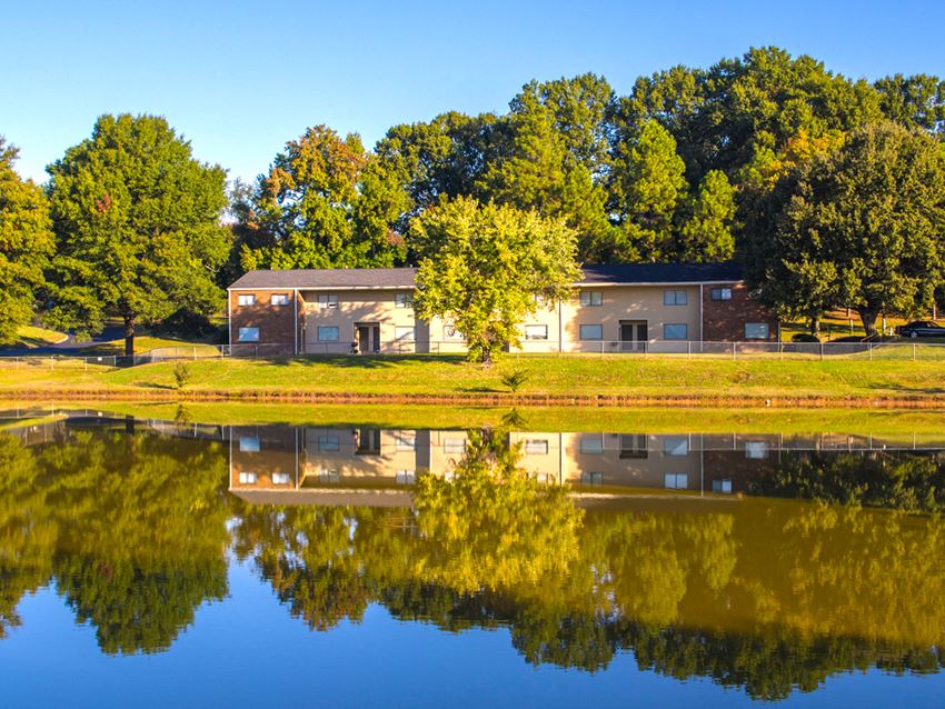 this home is located on the banks of a small lake