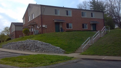 a house on a hill with stairs in front of it