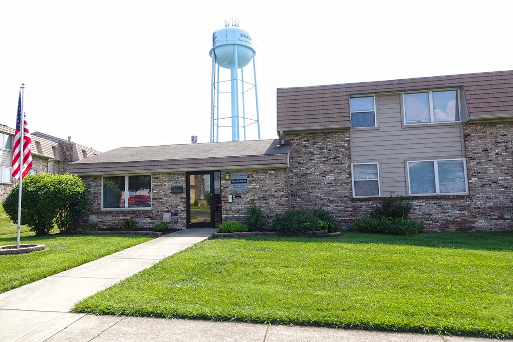 a house with a water tower in the background
