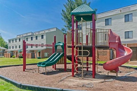 a playground with a slide and other playground equipment