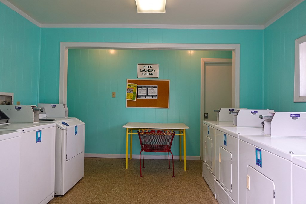 a room with many machines and a table in the middle
