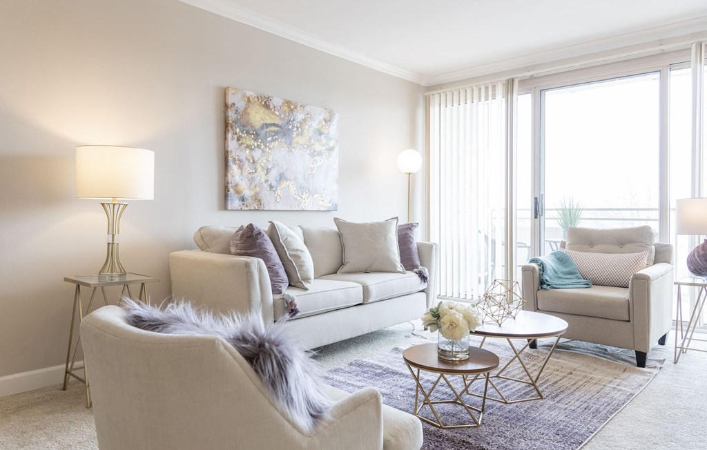 a living room with a couch and chairs