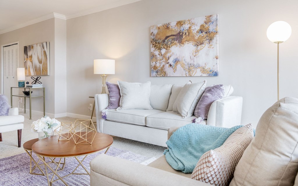 a living room with a couch and a table