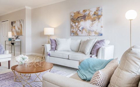 a living room with a couch and a table