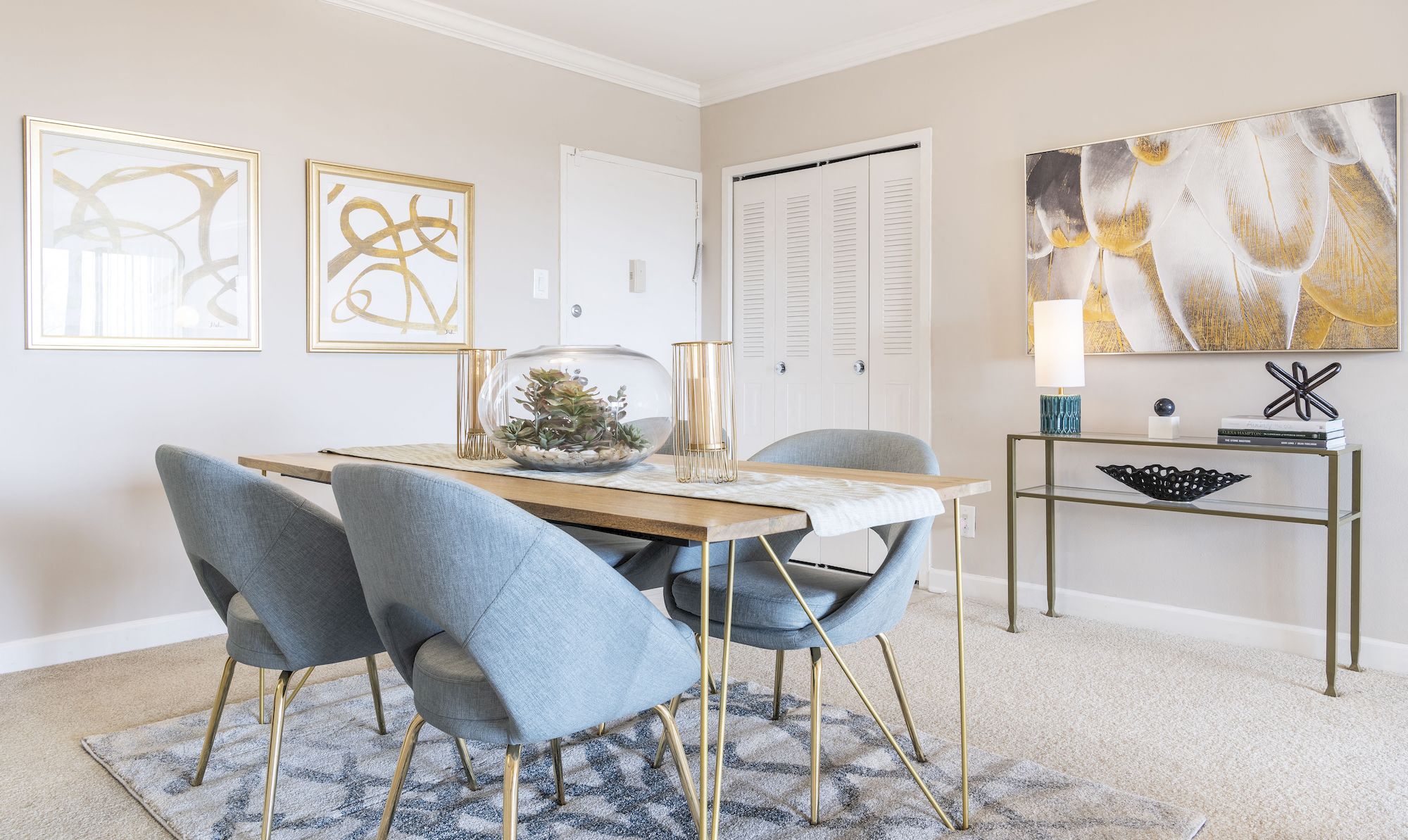 a dining room with a table and chairs
