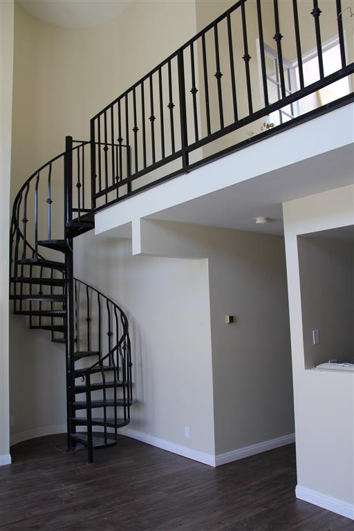 Stairs leading up to loft in one bedroom
