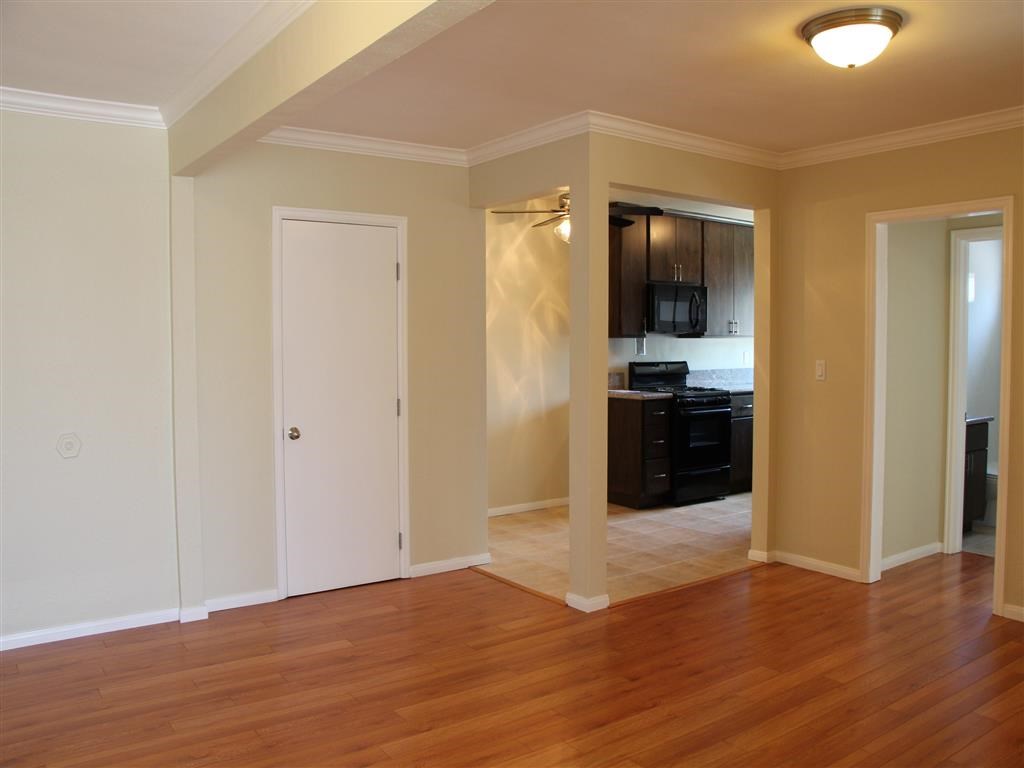 Entrance of unit with view of kitchen and front door