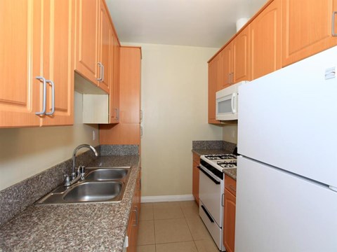 a kitchen with a sink and a refrigerator