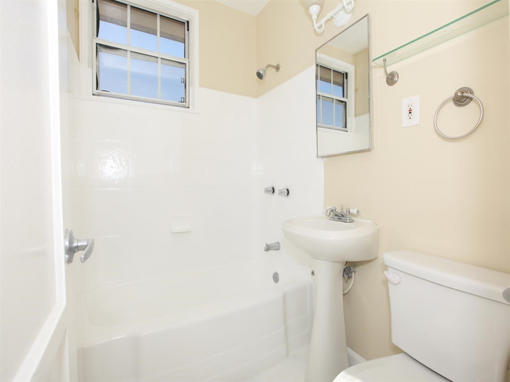 Bathroom with vanity and tub