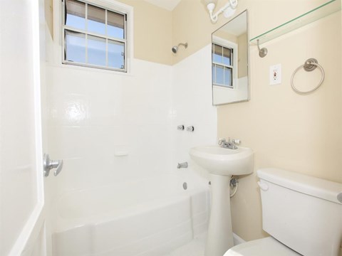 Bathroom with vanity and tub