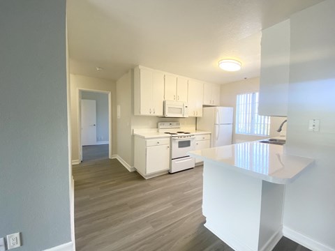 Kitchen with Island and view of hallway