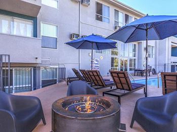 Fire Pit Near Swimming Pool at Oxnard Plaza Apartments