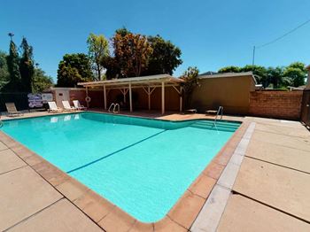 Large Swimming Pool With Shaded Lounge Area at Sylvan Gardens Apartments