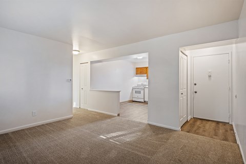 A room with a carpeted floor and a white ceiling.