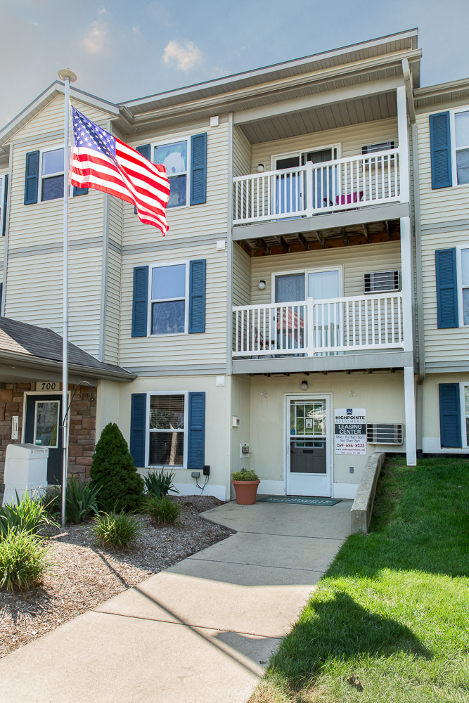 an flag flies in front of a house