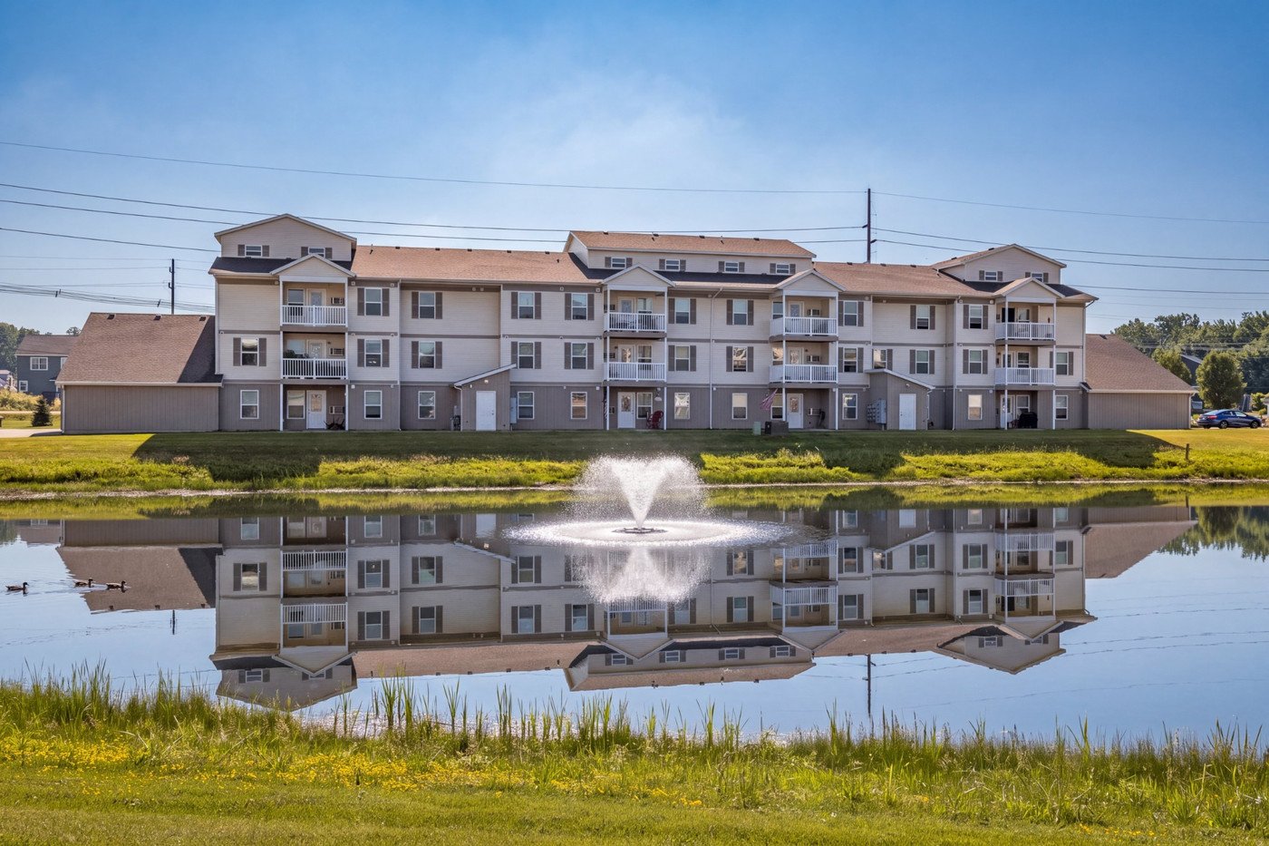 A building is reflected in a body of water.