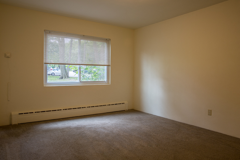 an empty room with a window in it