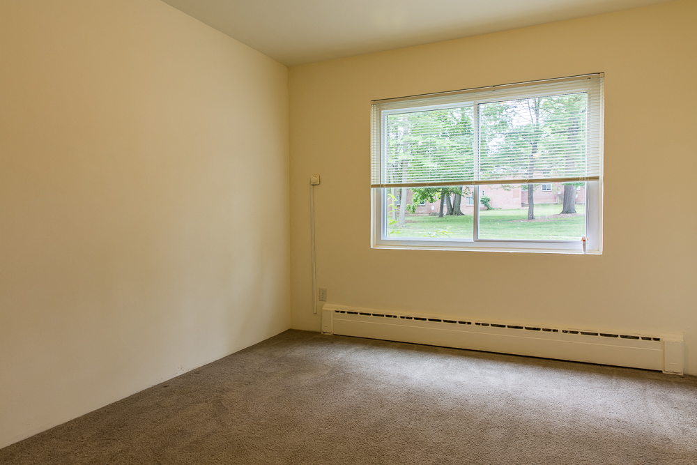 an empty room with a window in it