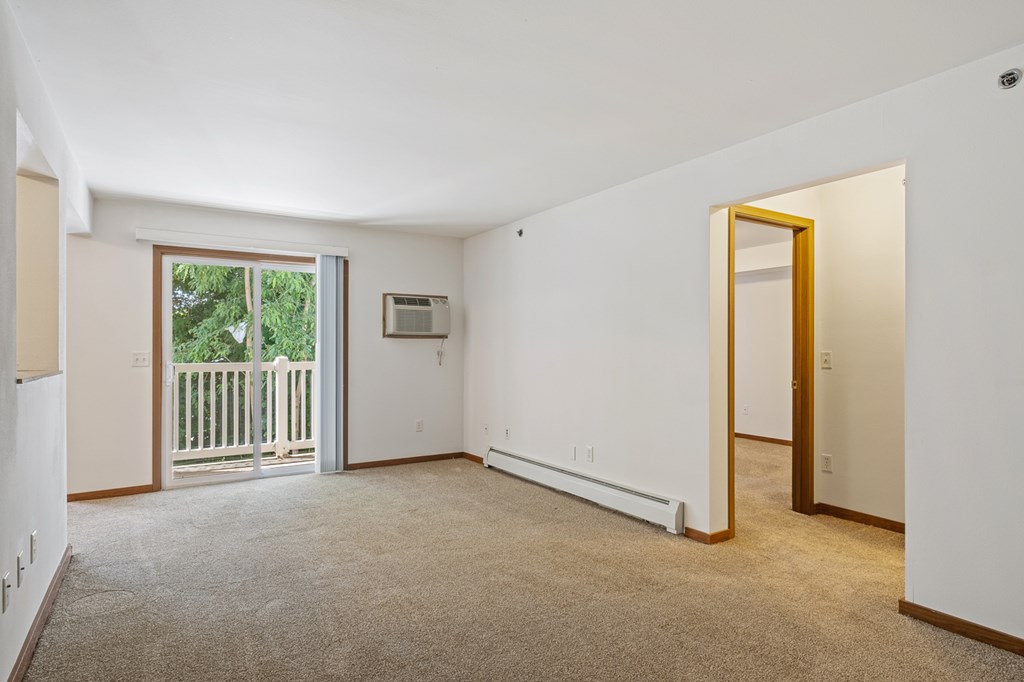 A room with a window and a door.