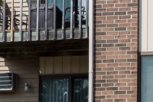 Wimbledon Apartment Building Entrance a brick apartment building with a green door