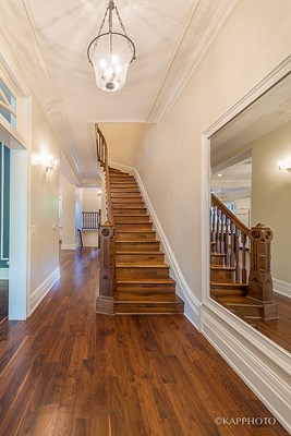 a view of the stairs from the entryway of a house