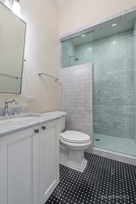 a small bathroom with a toilet and a shower