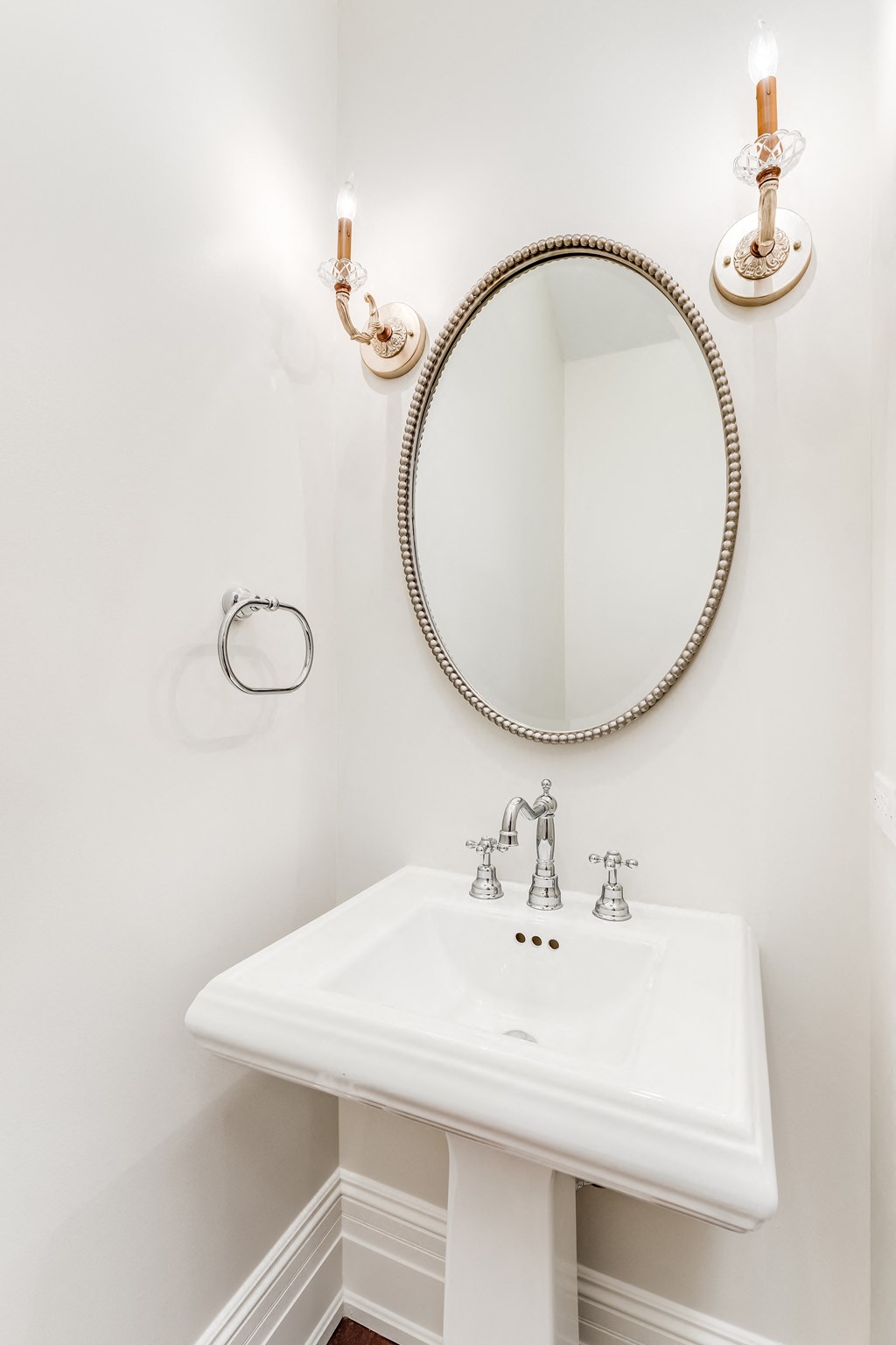 a small bathroom with a sink and a mirror