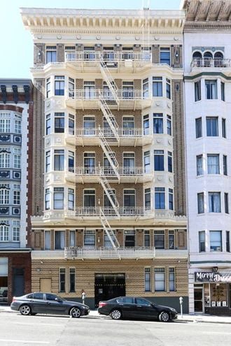 a tall building with a fire escape on the side of it
