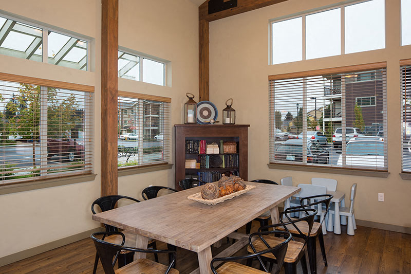 Clubhouse large table and windows Vancouver, WA Apt Rentals | Copper Lane