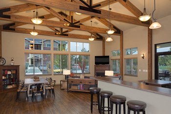 Clubhouse with seating and kitchen Vancouver, WA Apt Rentals | Copper Lane - Photo Gallery 3