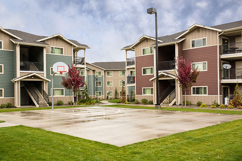 Basketball court by apt buildings Vancouver, WA 98684 | Copper Lane Apartment Homes