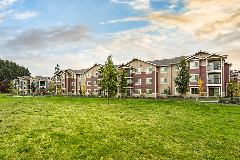 Community buildings and grass Copper Lane Apartment Rentals | Vancouver, WA 