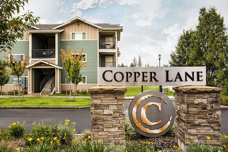 Entrance with monument sign Copper Lane Apts For Rent | Vancouver, WA - Photo Gallery 1
