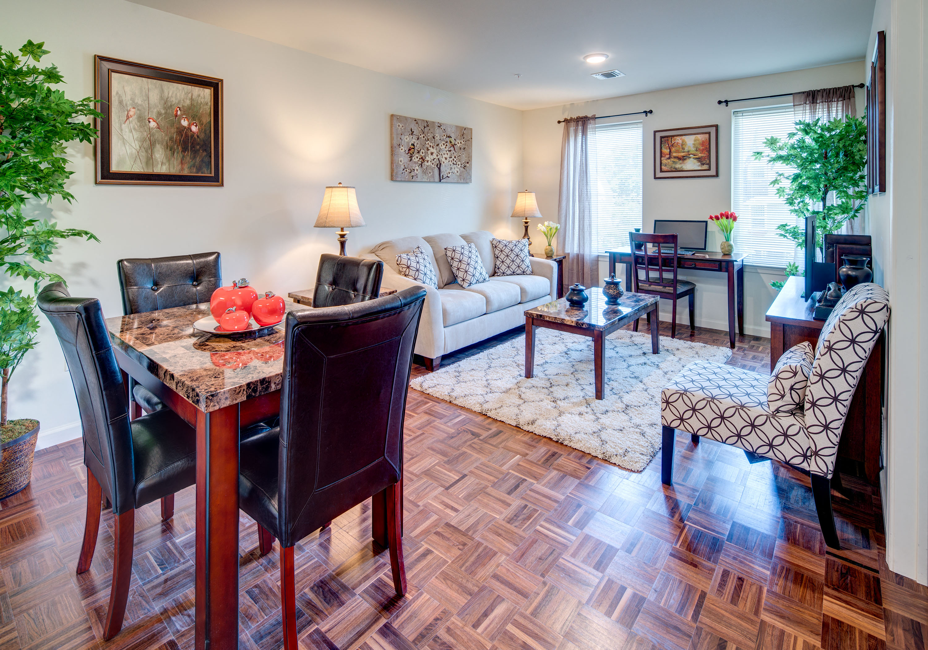 a living room and dining room with a couch and a table