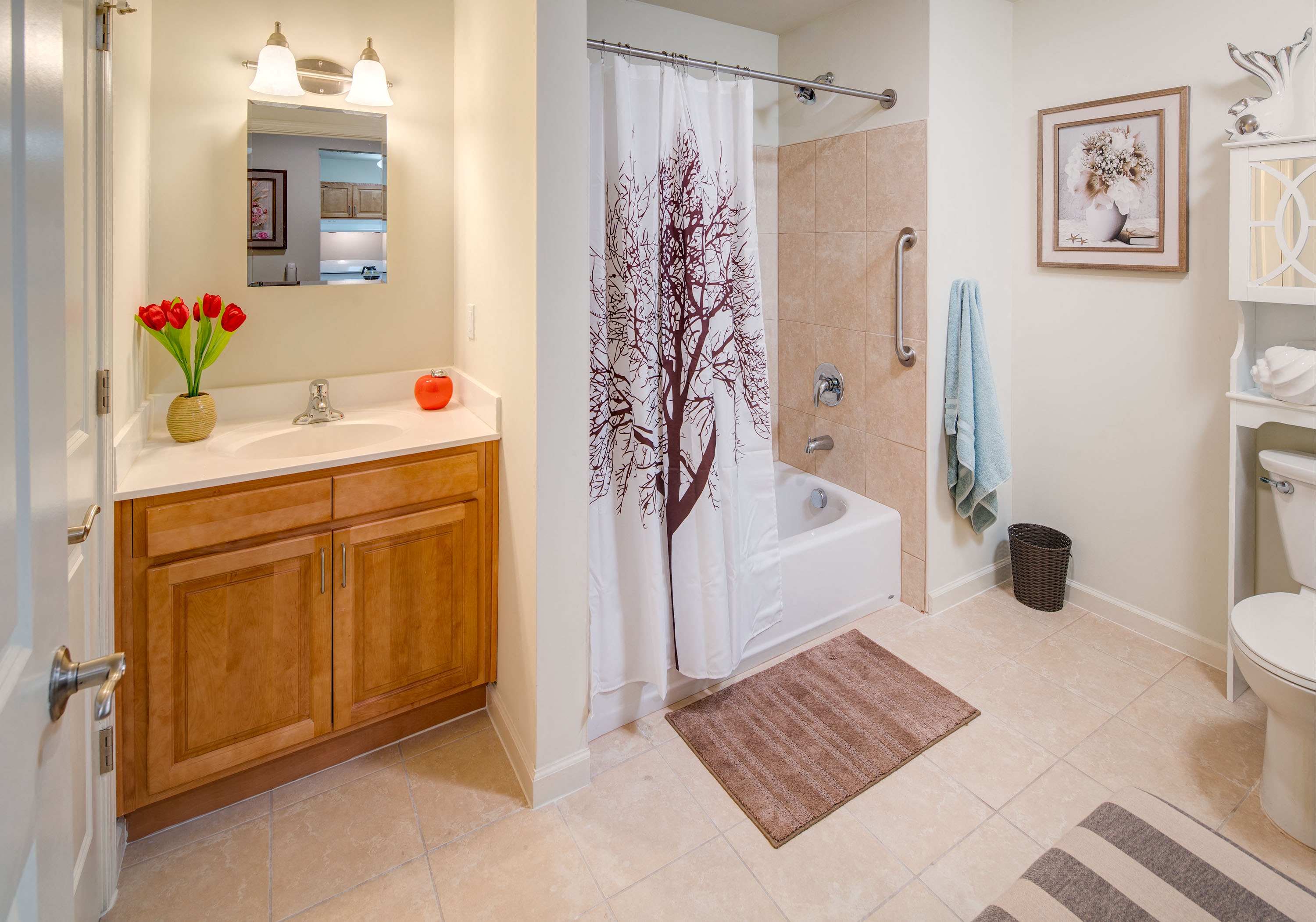 a bathroom with a shower and a sink and a toilet