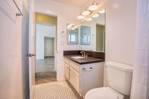 a bathroom with a toilet and a sink