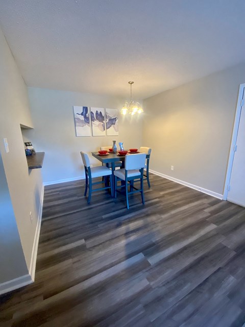 a dining room with a table and chairs in a home