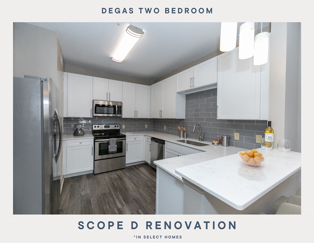 a remodeled kitchen with white cabinets and stainless steel appliances