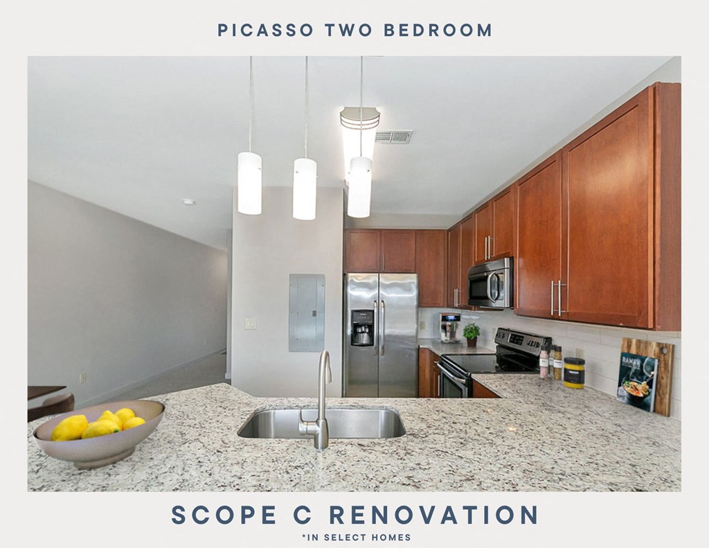 a kitchen with wood cabinets and a granite counter top