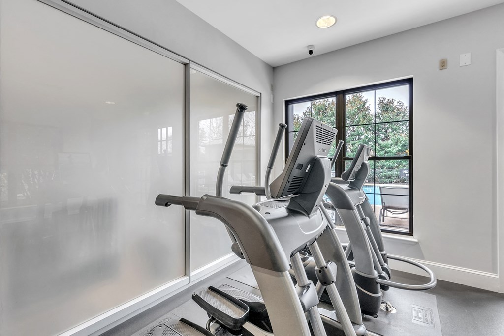 the gym has plenty of cardio equipment at the enclave at woodbury apartments