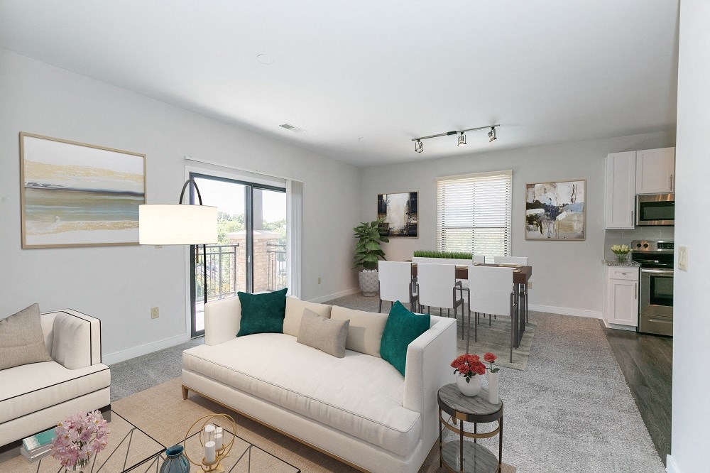 a living room and dining room with a couch and a table