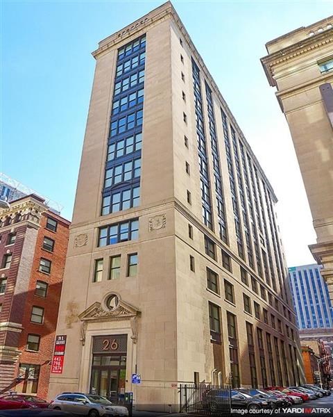 a tall building in the middle of a city