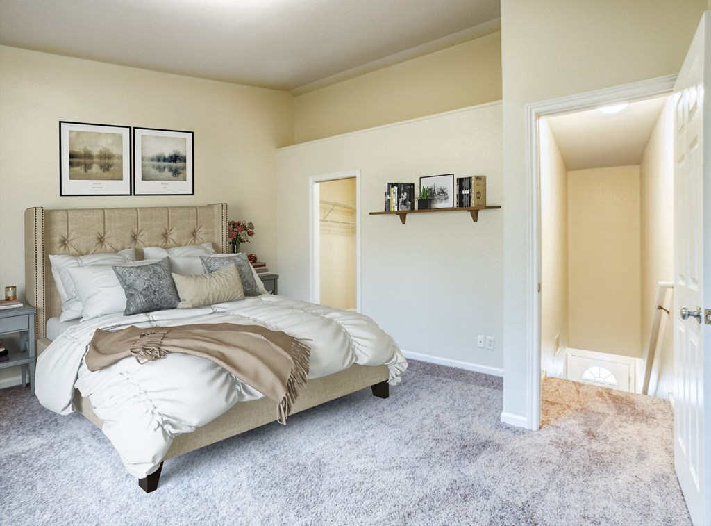 a bedroom with a bed and a door to a closet